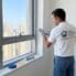 BHMS handyman applying silicone sealant How to reseal a window in a Dubai apartment