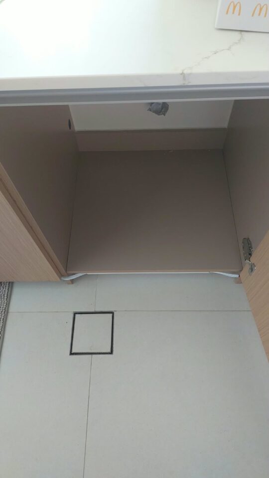 Sink cabinet base damaged by water